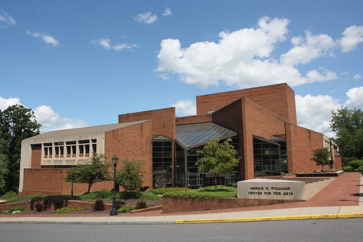 Students walking in front of South College Dorm